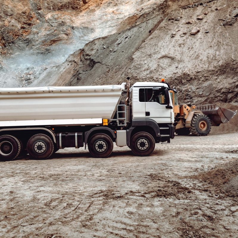 industrial-dumper-trucks-working-on-highway-constr-2024-09-21-23-08-12-utc-min
